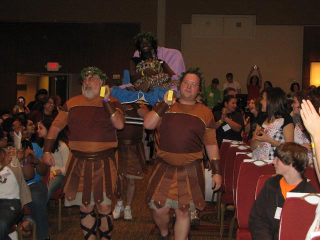 IMG_6621.JPG - Here they come!  The ‘Gov’ has a lot of faith, daring and trust to let this ‘group of four’ bring her down center isle with all those Key Clubbers watching.  But they did it, delivering Gov. Samah safe and sound to the waiting podium for her welcoming remarks.