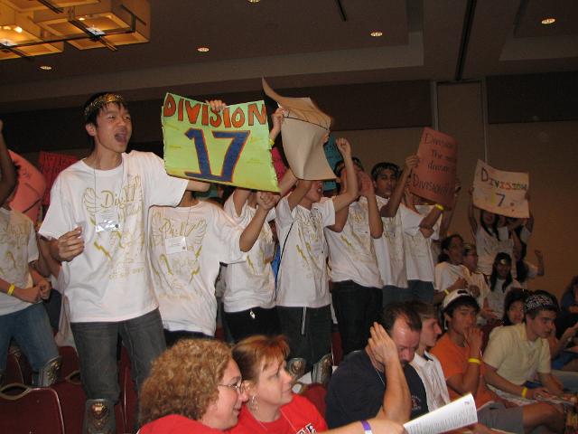 IMG_6637.JPG - After ALL take the Key Club Pledge, each the roll call of each Division in turn is done.  This is the “Spirit Stick” award contest, too, with the loudest … well, screaming by a Division wins the “Spirit Stick” award.  The Advisor with his hand over his ear finds out what’s its like close up from the ever gentle Division 17, Montgomery County Maryland.