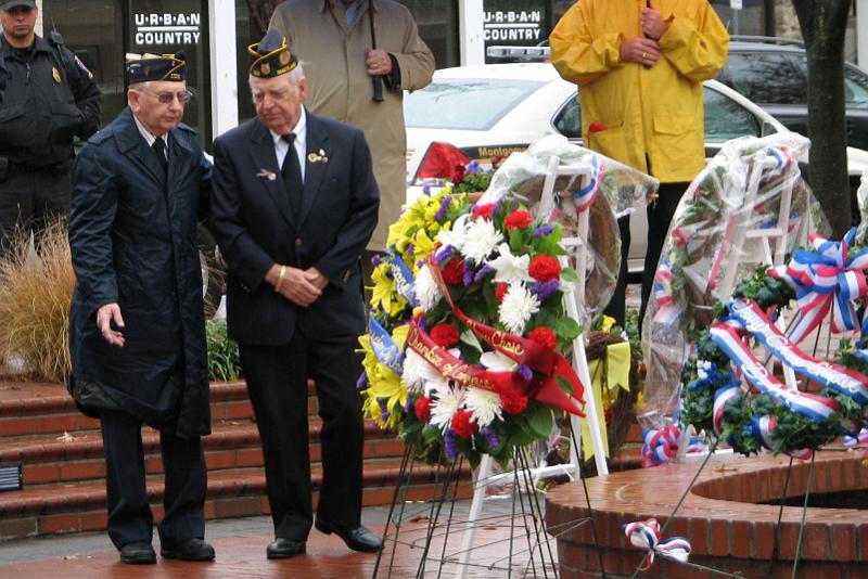 IMG_5503.jpg - Placing of Floral Tributes.  Representing American Legion Post #105, Clarence Mayberry, Chaplin, and Bob Waters, Post Commander honors veterans by their organization’s wreath.