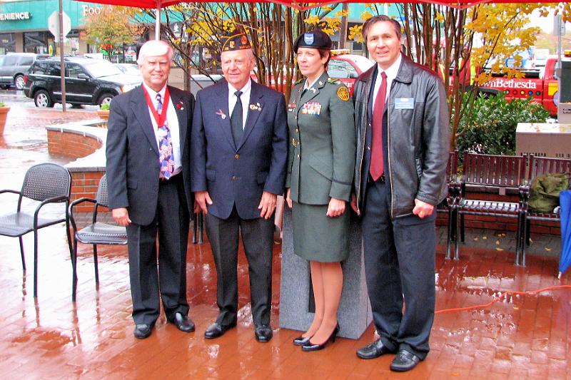 IMG_5535.jpg - Gathering after the ceremony are Kiwanian & Legion member Bob Cressy, American Legion’s Bob Waters, Key Note Speaker COL Katherine Miller and Kiwanian Richard Ruprecht.  Richard is the event organizer.  Thanks to you and Cathy Stephen.