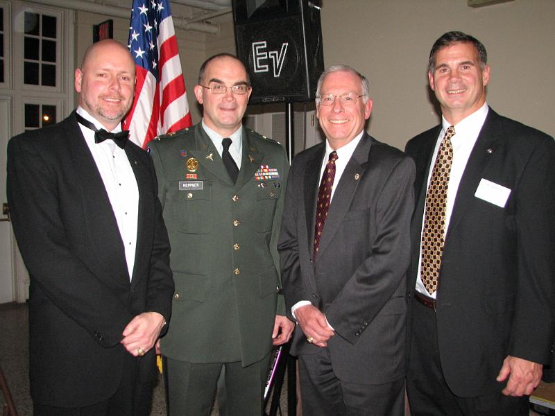 IMG_5934.JPG - Lynchburg President Ken Price, COL Gray Heppner M.D., Ed McCann and District Trustee David Heppner.  President Price presented COL Gray Heppner a check from the club for $1,100 to help his research.  The Lynchburg club nominated COL Heppner for his 2009 Kiwanis International World Service Medal award at the KI Convention in Nashville.