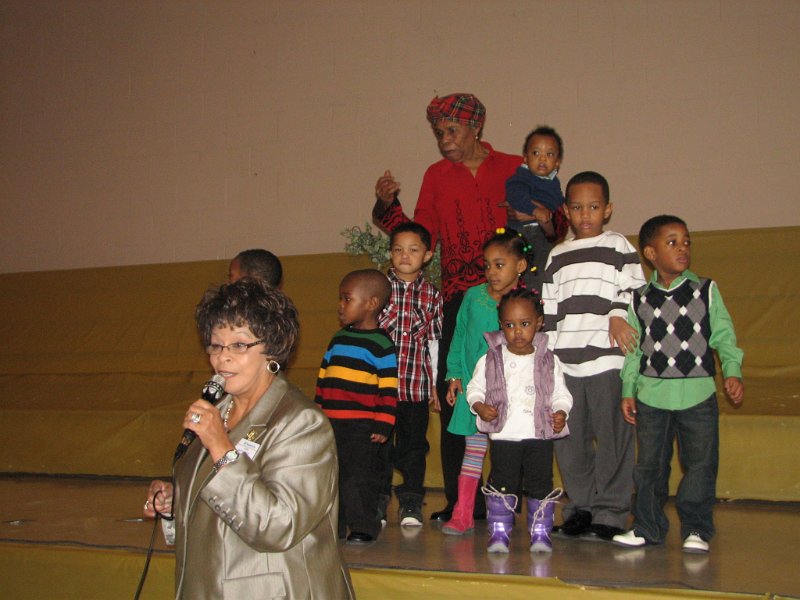 IMG_0345.JPG - Doris Montgomery, along with being the Capital District Kiwanis Trustee for the Potomac Region, is owner of Dor-Montes’ Day Care center.  Each year she has led a group of very young children, from two to six years old, in singing tributes to Dr. King on this day.  You can’t beat the really young with their singing, dancing, prancing and … well, cuteness.