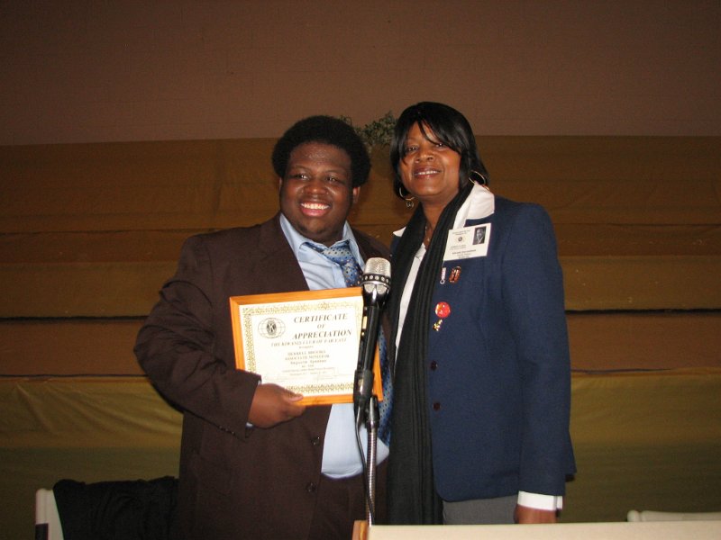 IMG_0361.JPG - The real surprise due his demonstrated maturity and clear message was that he is 15, going on 16, years old!  He receives a Kiwanis certificate of appreciation for his address from Kiwanian Barbara D. High.