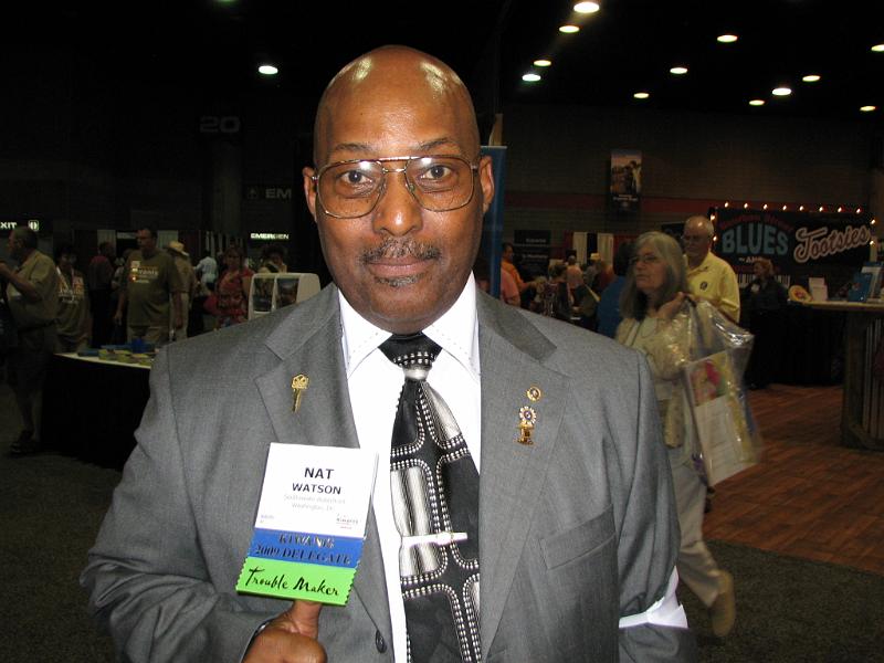 IMG_3658.JPG - PG Lynwood Watson showing his badge ribbons.  That bottom one says “Trouble Maker