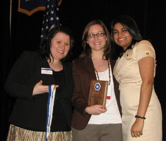 IMG_6539.JPG - CKI International Trustee Kristen Reed and CKI LG Sarah Smith present Avanti Kollaram the Carthage Pullman Award for her excellent year of leadership as Governor of the Capital District CKI for 2008-2009.  Well deserved!