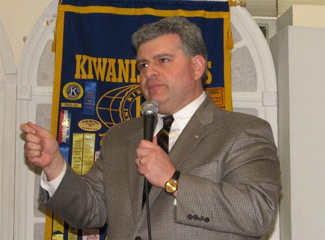 IMG_6327.JPG - President Paul addresses the Waldorf club praising them and giving them a pep talk.  And he said that Waldorf should strive to have the at least the same number of members at the end of the year as the year they were chartered (actually 1979) so he said they need to get to seventy-nine members by September.  Only three members fell off their chairs.  Watch out!