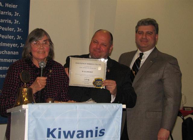 IMG_6334.JPG - Club Immediate Past President Bob Parks receives the 2008-2009 Distinguished Kiwanis Club Award with LG Millie Krimelmeyer and KI President Paul presenting it to the club.  Doesn’t get better than that!