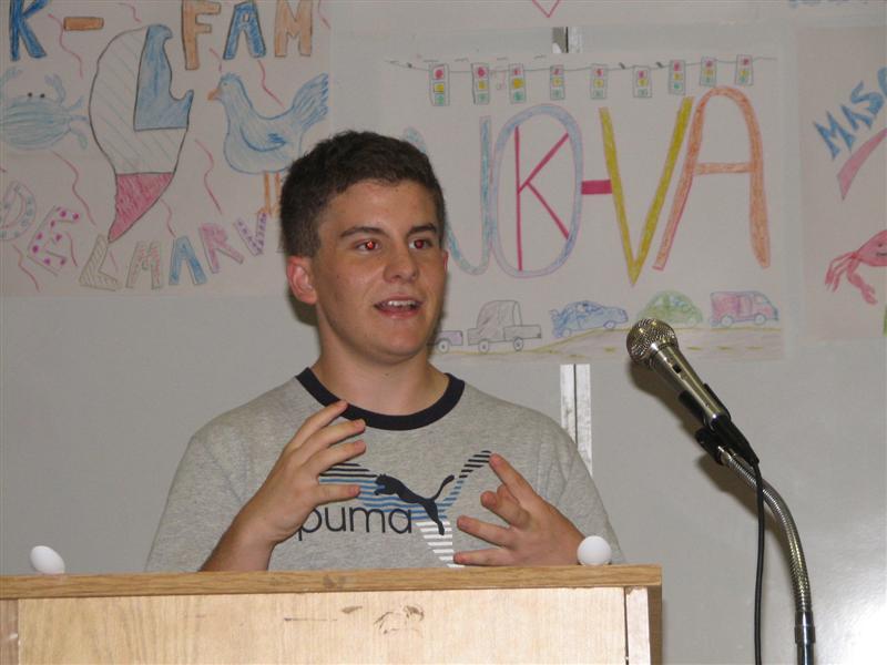 IMG_0417.JPG - Key Club LG Division 17 Brent Able on stage with a presentation.