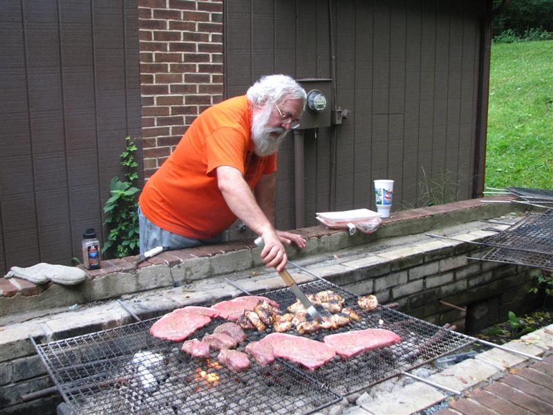 IMG_0464.JPG - Capital District Kiwanis Administrator Joe Stankus is head chef at the big cookout for sixty people or so.  I found out that’s so he can BBQ his own steak just right … still mooing.  I agree.  Great job, Joe!  On the whole weekend production, too!