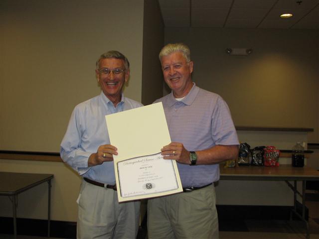 IMG_9190.JPG - LG Marv Jackson (2010-11) presented each club through its president a “Distinguished Service Award”.  Marv congratulates Olney Kiwanis President Marty Eley their certificate.  Nice recognition.