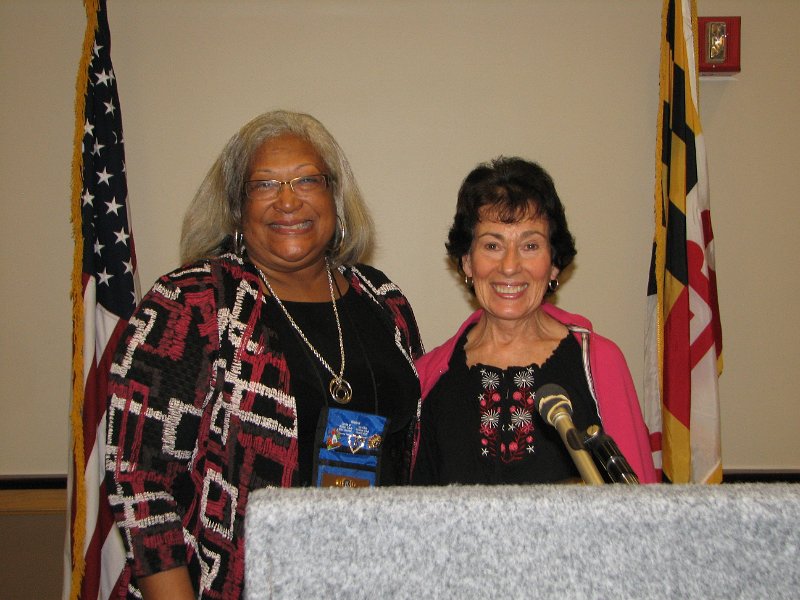 IMG_5384.JPG - Montgomery Village Kiwanis President Earleen Wood Reynolds (L) presented the first “Unsung Hero Award” to Kiwanian Mattie Gladstone for her strong member involvement in club projects and for Leading-By-Example her fellow Kiwanians.  Congratulations !