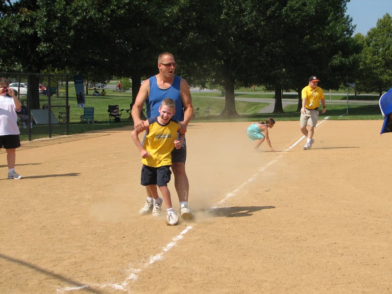 IMG_8889.JPG - It’s a Home RUN!  He’s running the third base to home plate base line.  A young delighted boy and his equally delighted son come into score.  The laughter sparked everyone to cheer!  It’s a Miracle!