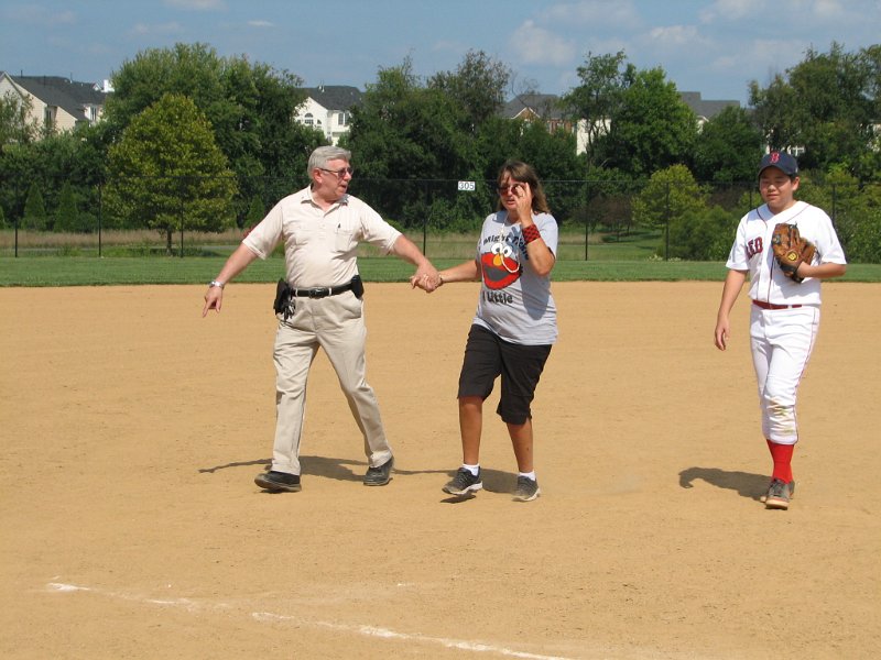 IMG_8895.JPG - Everyone gets a bit of exercise, too.  Here Dave Benway, PLG Division 17 and a member of the Montgomery Village Club gets to run with a player on a three-bagger.