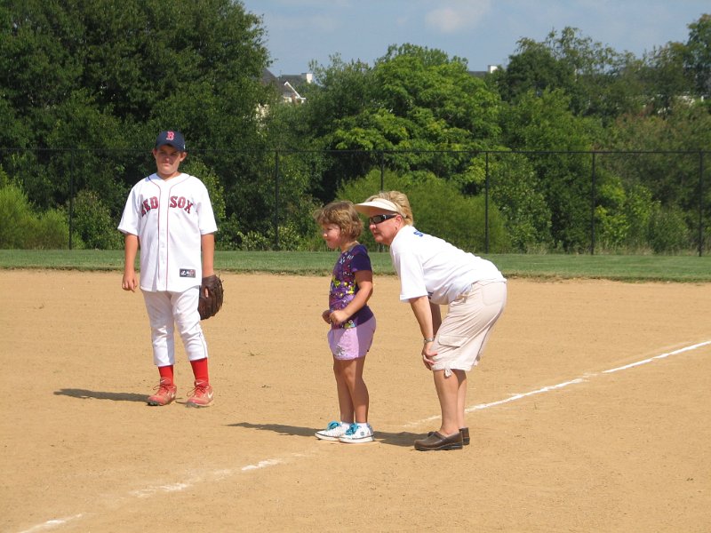 IMG_8898.JPG - The batting coach, Jeanne, stay with her player going on as running and base coach.  It’s busy!