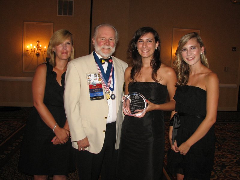 152.JPG - Out-going Capital District Sec/Treas Ellis Stroup was honored with the establishment of the annual Ellis H. Stroup Key Club Leadership Award, a $5,000 grant to a deserving member of Key Club! The first recipient is Kirsten Craig who was presented this year's Stroup Award by Past-Gov John Tyner. Pictured (L to R) are Jennifer Craig (mother), John Tyner, Kirsten Craig, Katie Craig (sister).