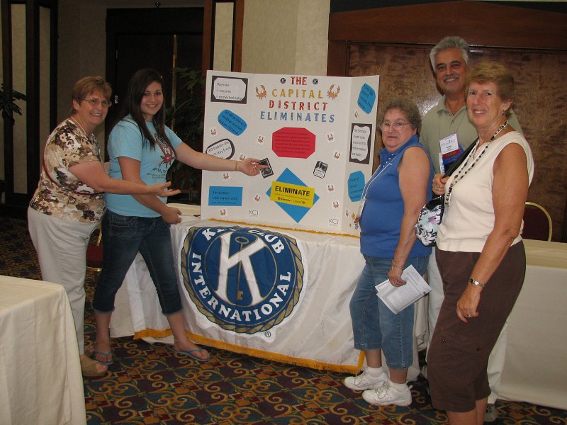 IMG_5056b.JPG - Folks gather around CD Key Club table displaying Key Club's commitment to supporting The Eliminate Project.