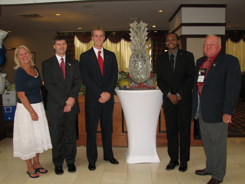 IMG_5060.JPG - Your Convention leaders gathered at the beautiful ice sculpture Pineapple, the symbol for Colonial Friendship (the pineapple, not the ice) as the festivities began. From the left are Caren Schumacher, 2011 Convention Chair and Immediate Past President of the Williamsburg Club, Capital District Governor Elect Jeffrey Wolff, CKI Governor Ryan White, __________ and Capital District Governor Tom Varner. On Thursday there already was the Kiwanis Golf Tournament to support the Kiwanis International Eliminate Project and during Friday, the Capital District Board of Trustees meeting and the Capital District Kiwanis Foundation Board Meeting. Now we’re ready for some FUN, education and fellowship!