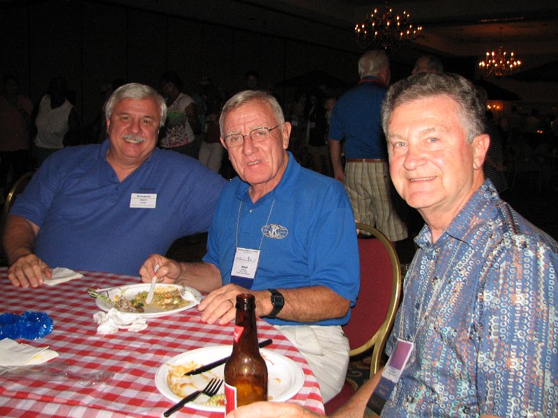 IMG_5071.JPG - The “Friday Night Social” kicked off the FUN. Your committee arranged for a huge tropical buffet for everyone with chicken, salads, you name it … and ice cream. What else in Williamsburg? It was GREAT! Your hosts included Wade Quinn, President of the Williamsburg Kiwanis Club, Brian Wilson, PLG of host Division 13, and PLG Tom French. Thanks!