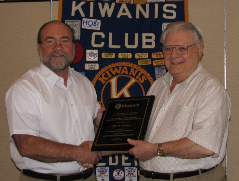 ellis.jpg - The nearly 7000 members of the Capital District have honored Ellis with a Lifetime Membership in the Capital District as well as by declare Ellis Capital District Secretary/Treasurer Emeritus. Pictured (L to R) fellow club member Dave Maloney presents Ellis with his plaque. 